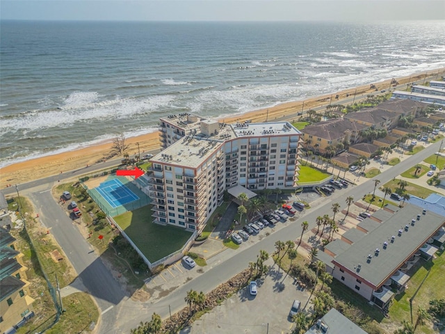 aerial view with a water view and a view of the beach