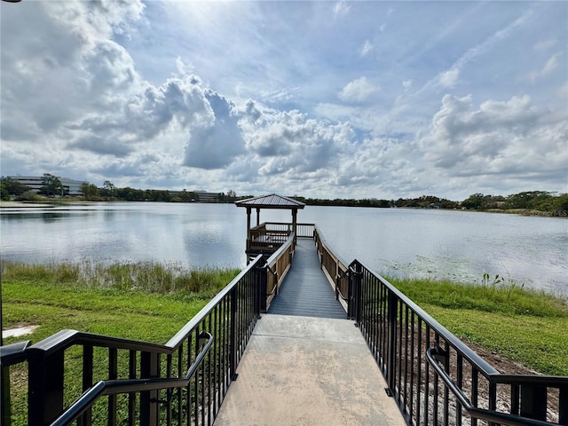 dock area with a gazebo and a water view