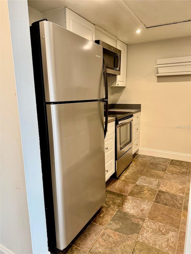 kitchen featuring white cabinetry and stainless steel appliances