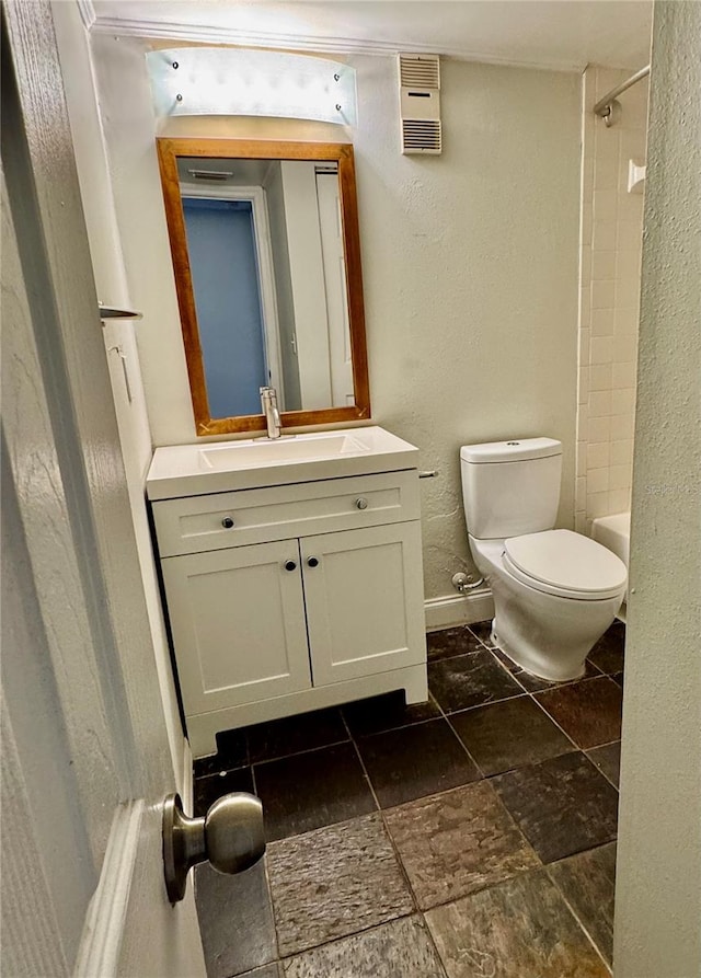 full bathroom with vanity, shower / tub combination, and toilet