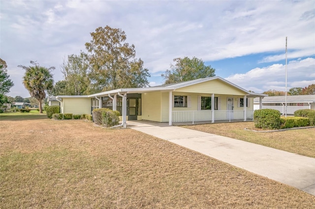 10170 SW 96th Ct, Ocala, FL 34481 - single story home featuring concrete driveway, a front lawn, covered porch, and a carport