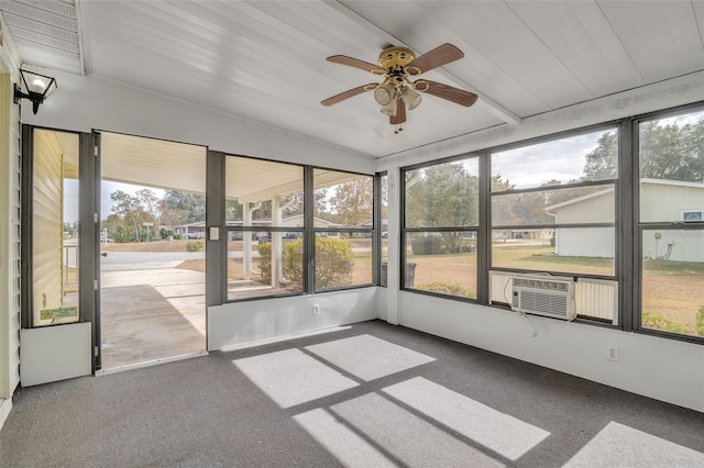 unfurnished sunroom with plenty of natural light, ceiling fan, wood ceiling, and cooling unit