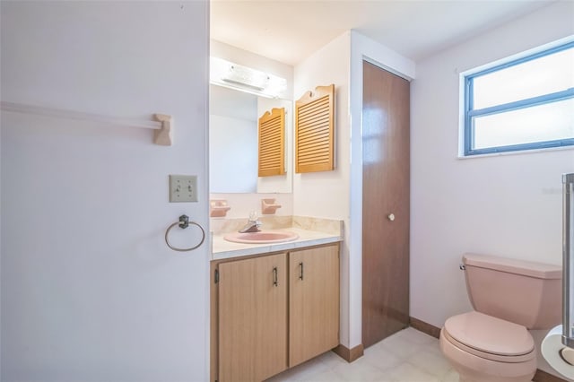 10170 SW 96th Ct, Ocala, FL 34481 - bathroom featuring vanity, toilet, and baseboards