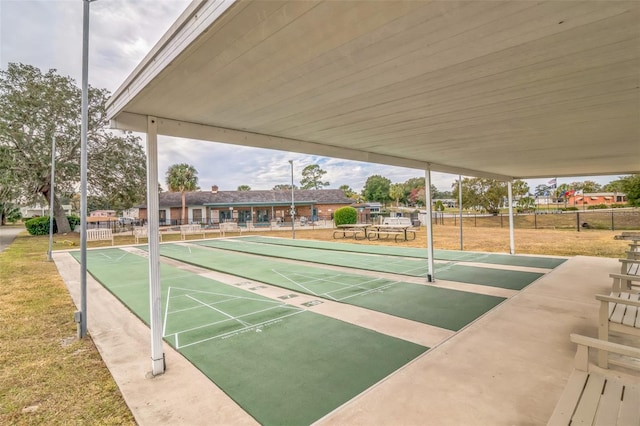 view of property's community with a yard