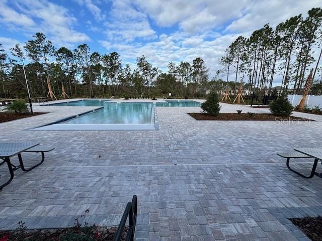 pool with a patio