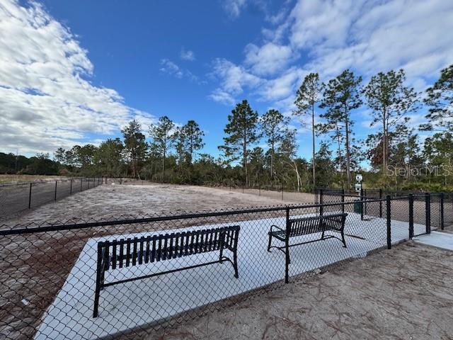 view of property's community with fence