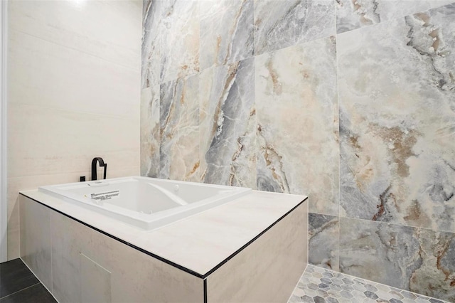 bathroom with tile walls