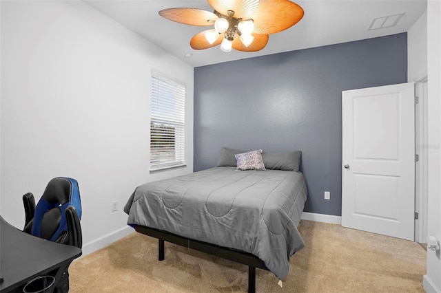 bedroom with visible vents, baseboards, and light colored carpet