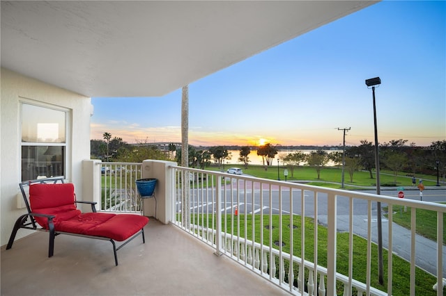 view of balcony at dusk