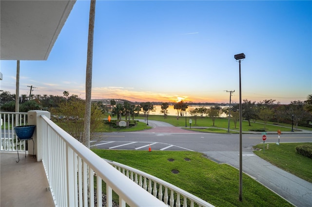 view of balcony at dusk