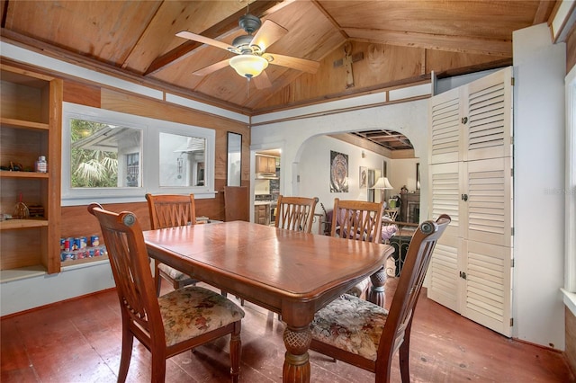 dining room featuring lofted ceiling, hardwood / wood-style flooring, wood ceiling, and ceiling fan