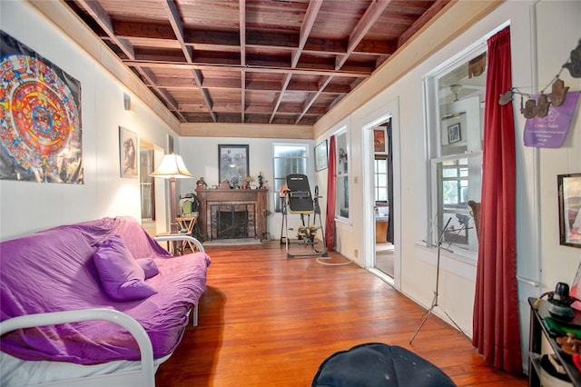 living room with wood ceiling and wood-type flooring