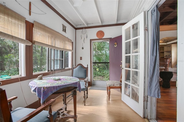 sunroom featuring beamed ceiling