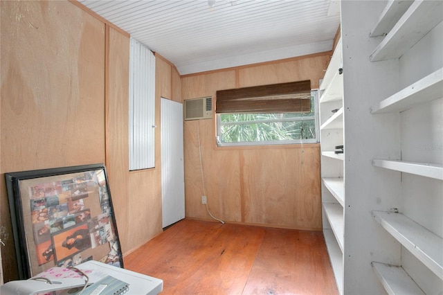 interior space with wood walls and light wood-type flooring