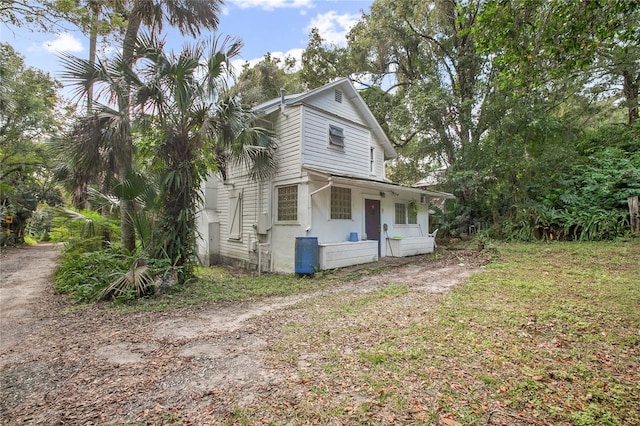 view of property exterior featuring a porch