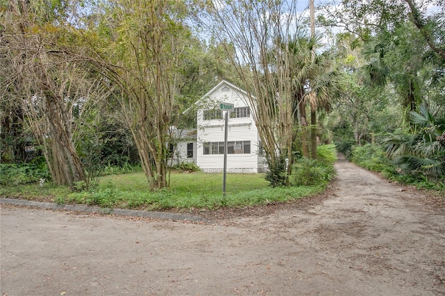 view of side of property with a balcony