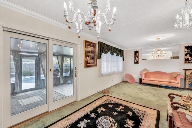 living room featuring crown molding, a notable chandelier, carpet flooring, and a textured ceiling