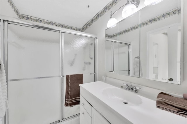 bathroom with vanity and walk in shower