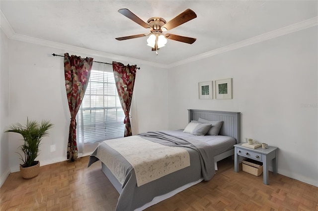 bedroom featuring parquet flooring, crown molding, and ceiling fan