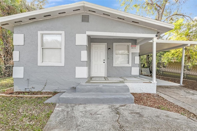 view of front of property with a carport