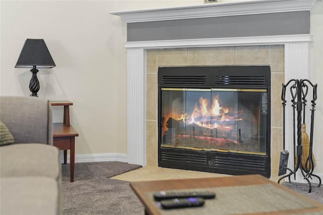 room details with a tile fireplace and carpet flooring