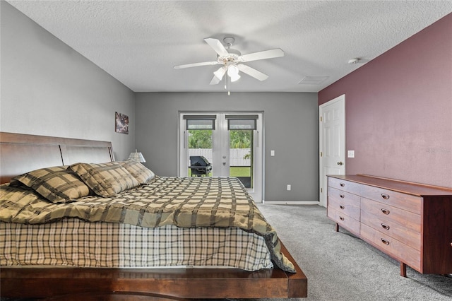 bedroom featuring a textured ceiling, light carpet, french doors, access to exterior, and ceiling fan