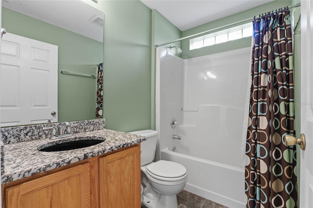 full bathroom featuring toilet, vanity, and shower / tub combo with curtain