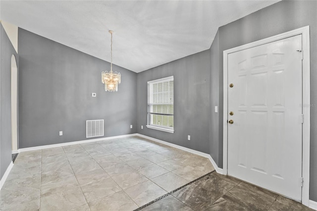 foyer entrance with an inviting chandelier