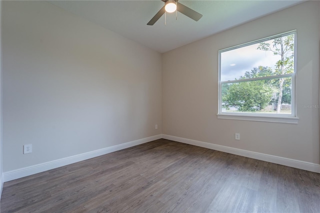 unfurnished room with ceiling fan and wood-type flooring