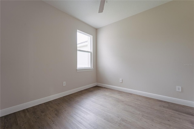 empty room with light wood-type flooring and ceiling fan