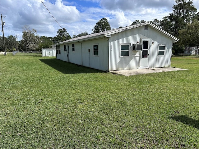 rear view of house with a yard