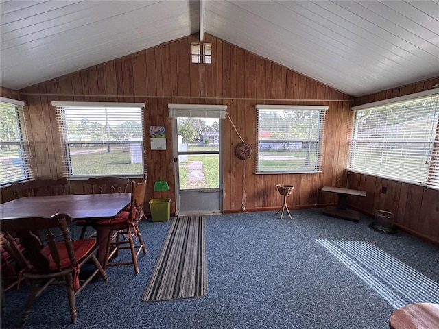 sunroom with a wealth of natural light, vaulted ceiling, and wood ceiling