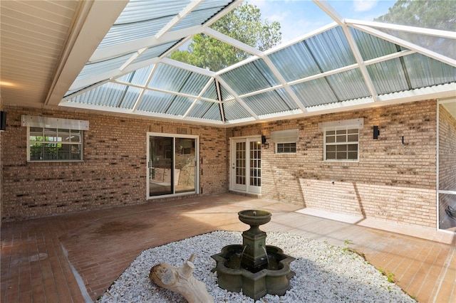 exterior space featuring french doors and glass enclosure