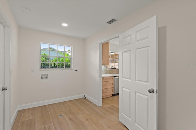 spare room with light hardwood / wood-style floors