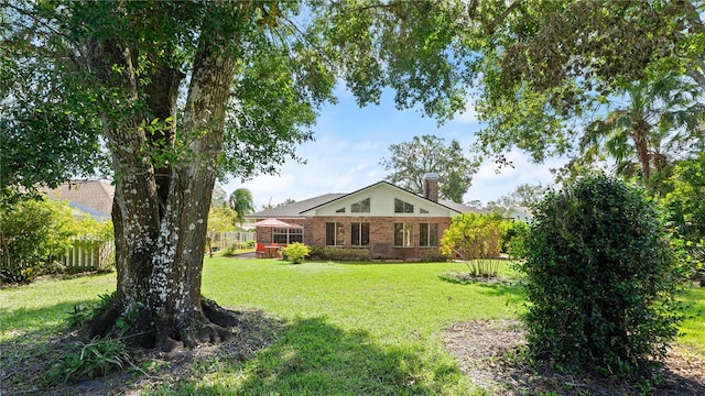 view of yard with a sunroom