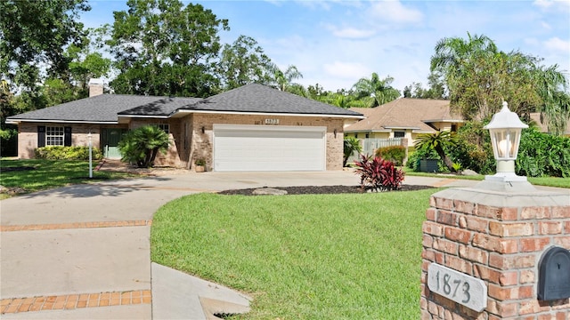 ranch-style home with a front yard and a garage