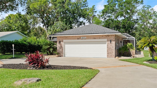 exterior space featuring a front yard and a garage