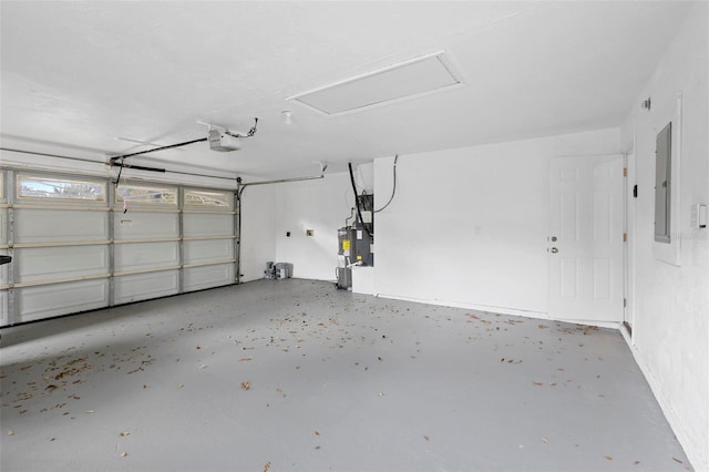 garage featuring a garage door opener and electric panel