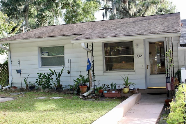 view of front of home with a front yard