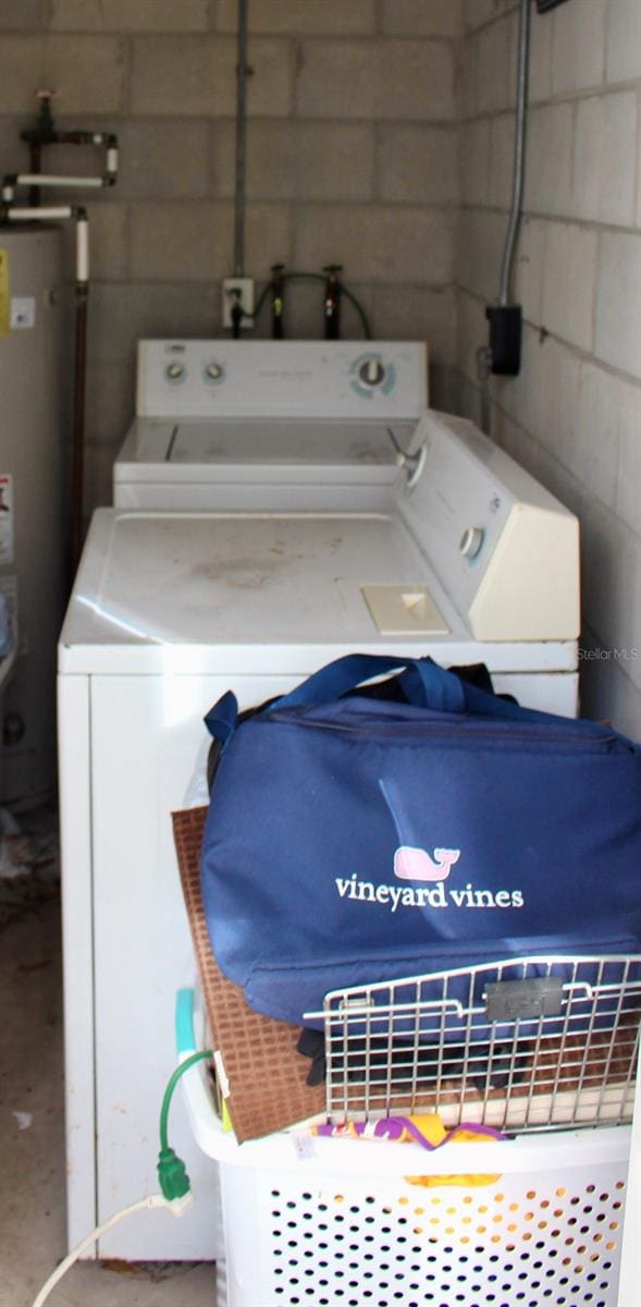 laundry room featuring washer and dryer and gas water heater