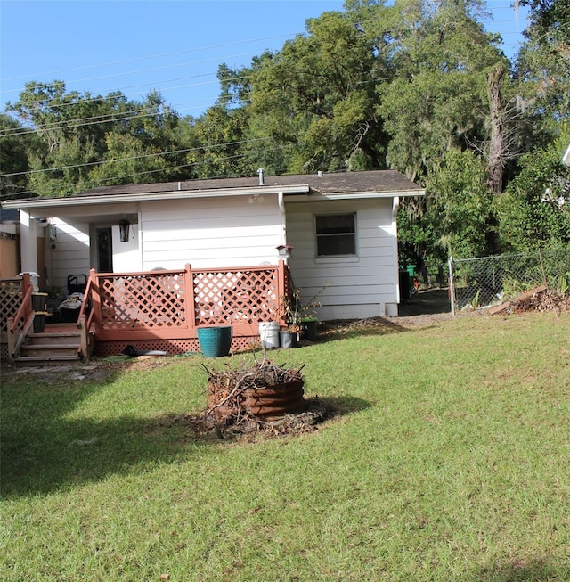 back of house featuring a yard