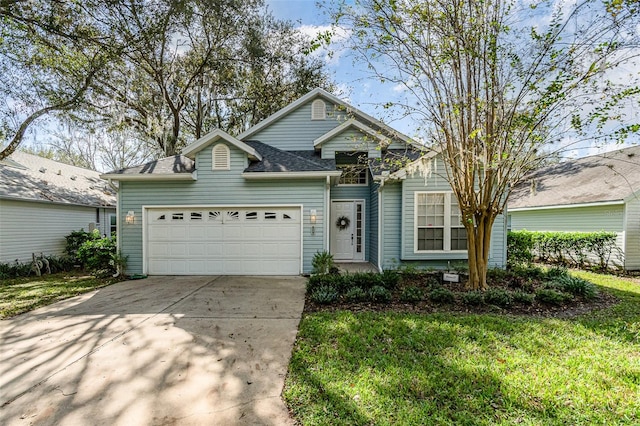 view of front facade featuring a front yard and a garage