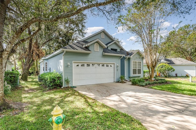 view of front of house with a front yard and a garage