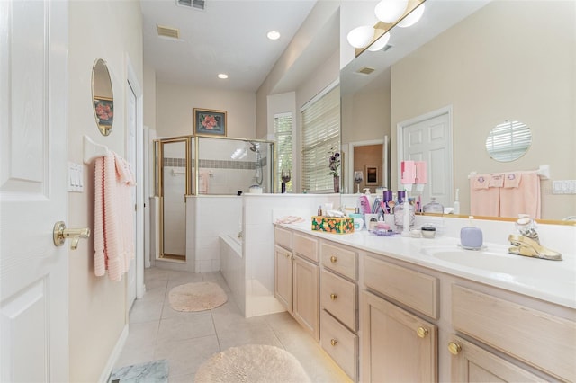 bathroom with vanity, separate shower and tub, and tile patterned flooring