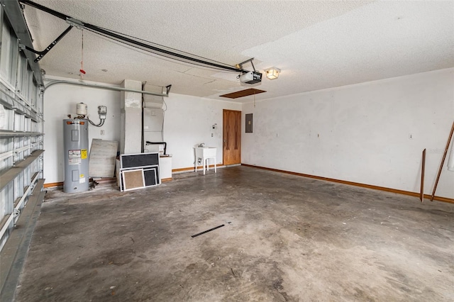 garage featuring electric panel, sink, a garage door opener, and electric water heater