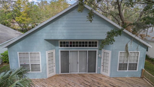 rear view of house featuring a deck