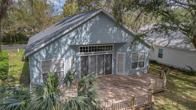 view of outdoor structure featuring a sunroom