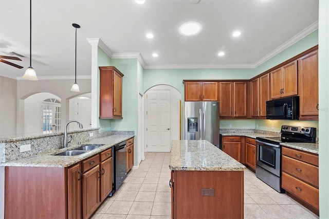 kitchen featuring black appliances, sink, ornamental molding, decorative light fixtures, and light stone counters