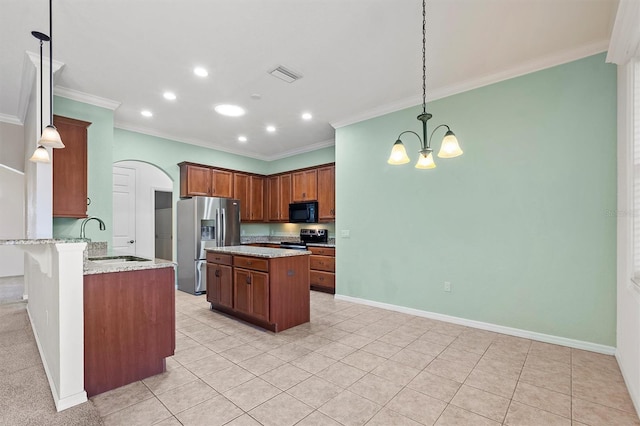 kitchen featuring pendant lighting, sink, appliances with stainless steel finishes, light stone counters, and kitchen peninsula