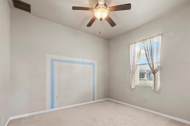 carpeted spare room with ceiling fan and a healthy amount of sunlight